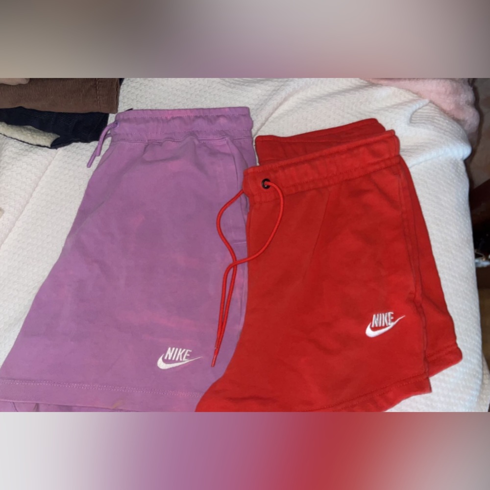 two pairs of nike sweat shorts
